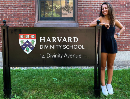 Ciara Moezidis, standing next to HDS sign