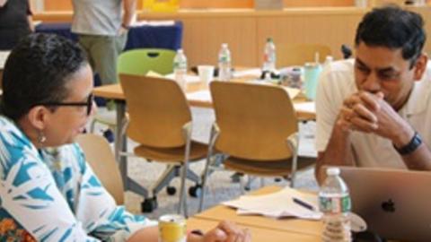 Monika Johnston speaking with fellow educator at RPL's Religious Literacy Summer Insititute for Educators 2023