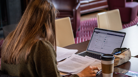 Student working at her laptop