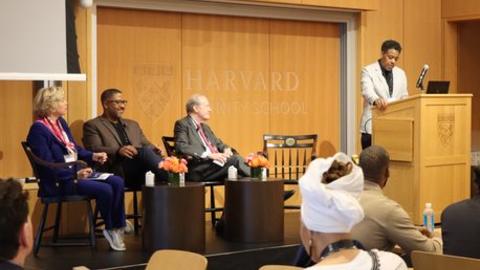 Terrence Johnson speaks at the podium ahead of a conference session during RPL's spring 2026 conference.