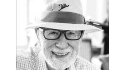 Sid Topol in black and white with white border