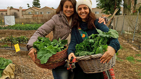 Geographer and seed saver Linda Quiquivx with Religion, Conflict, and Peace Initiative Fellow Vivien Sansour