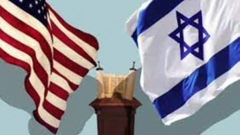 American and Israeli flags hang above a Torah