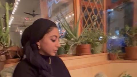 Zehra Iman, side profile, eyes averted gazing downward