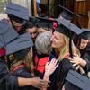 MRPL class of 2021-22 have a group hug with Diane L. Moore at graduation