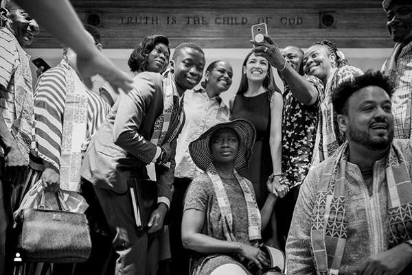 A group of people post for a photograph.